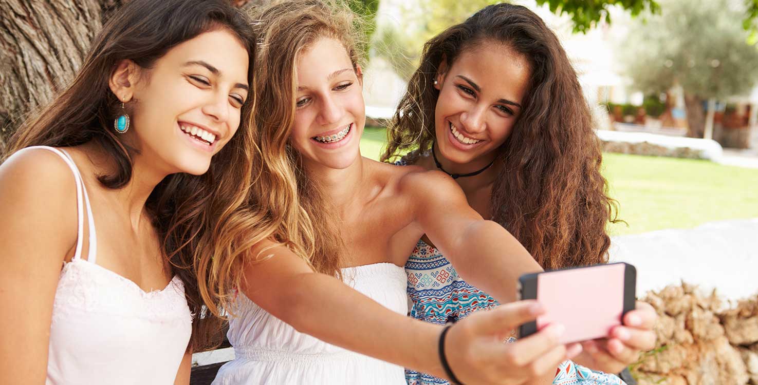 teens taking selfie