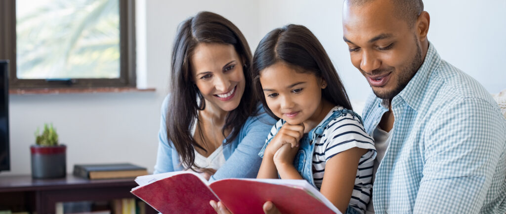 Parents reading with kid